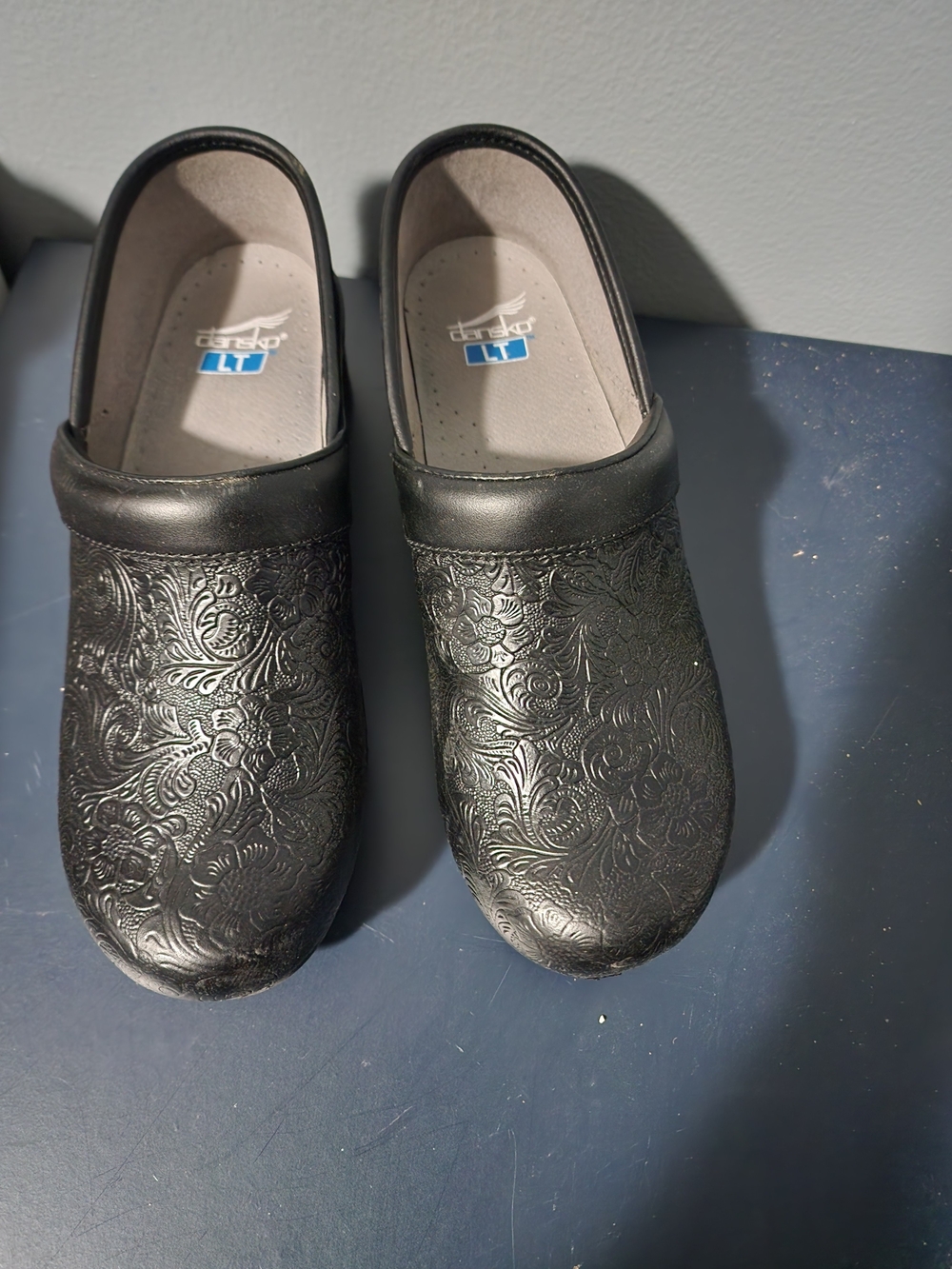 Dansko Black Embossed Floral Leather Clogs
